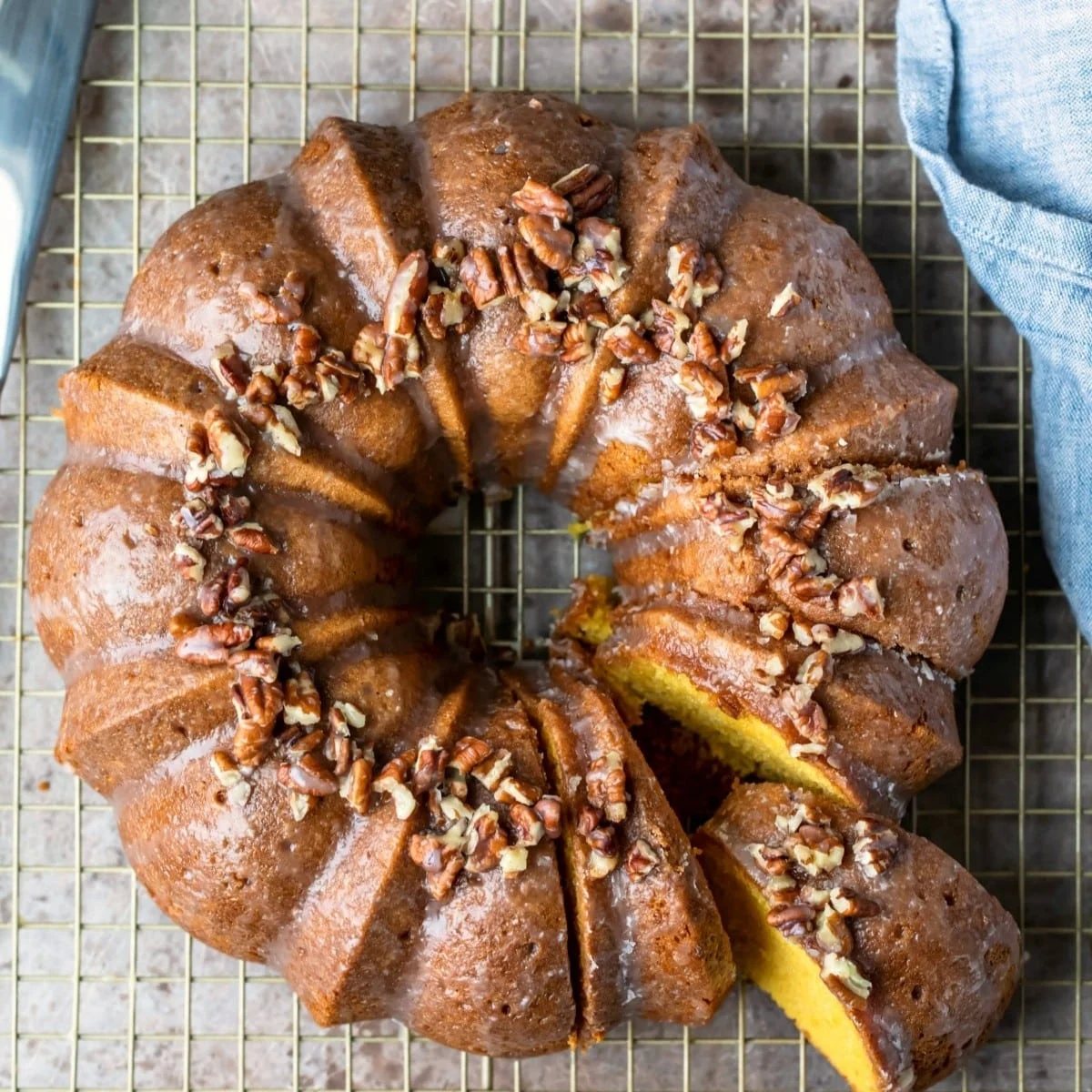 An image of an Irish cream Bundt cake with a slice removed.