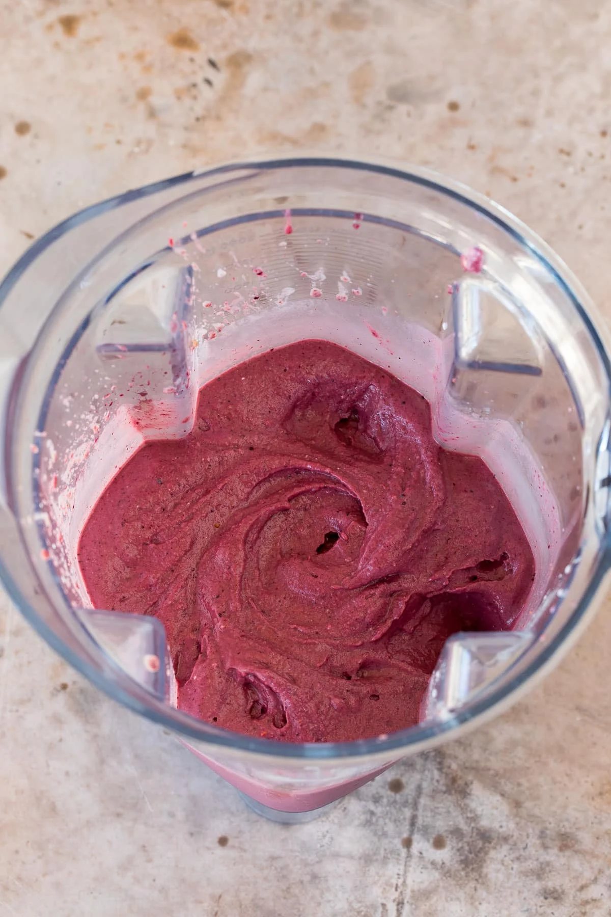 Pureed acai and fruit in a blender.