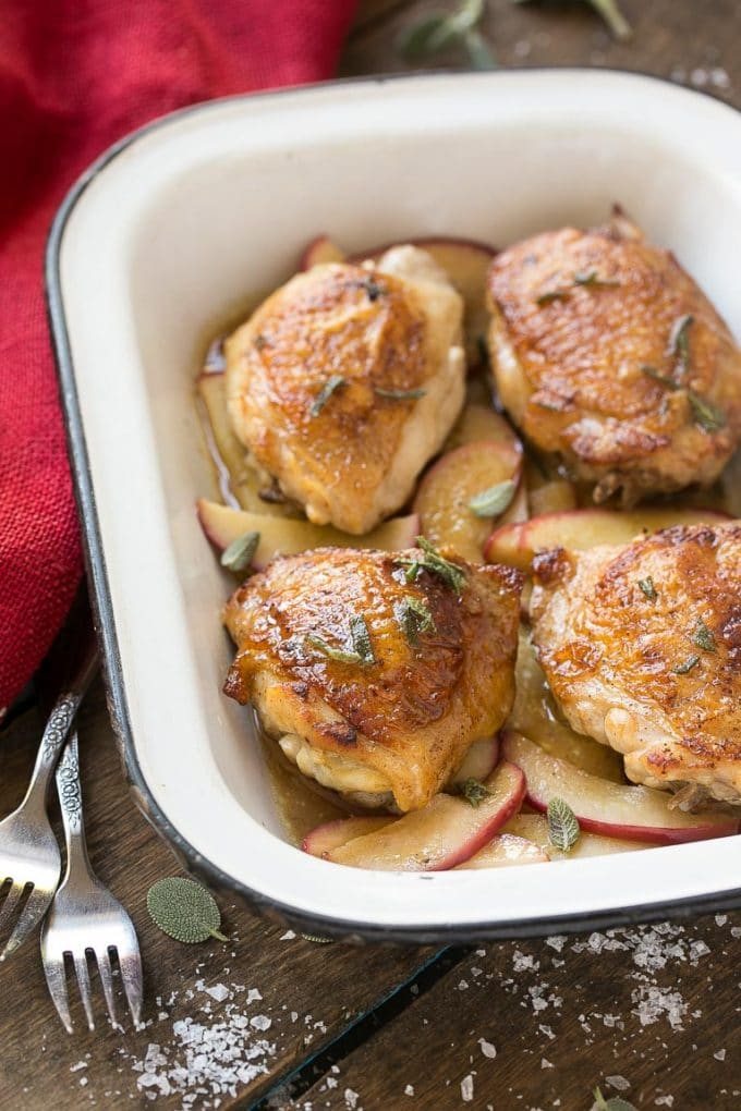 Cider glazed chicken thighs served over cooked apples.