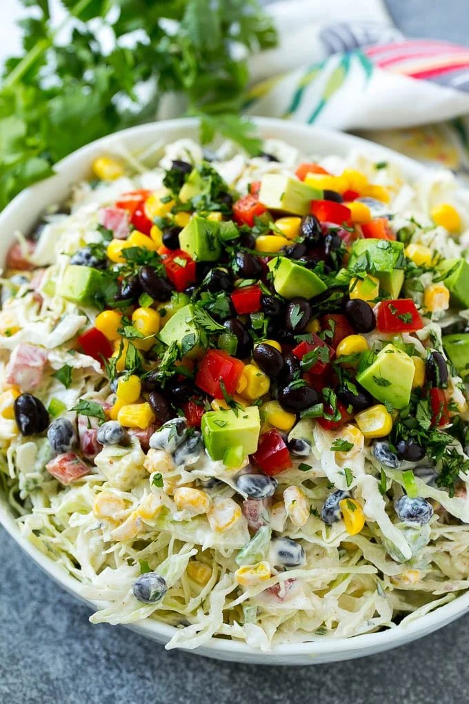 Mexican coleslaw made with cabbage, black beans, corn, red pepper and avocado, tossed in a silky dressing.