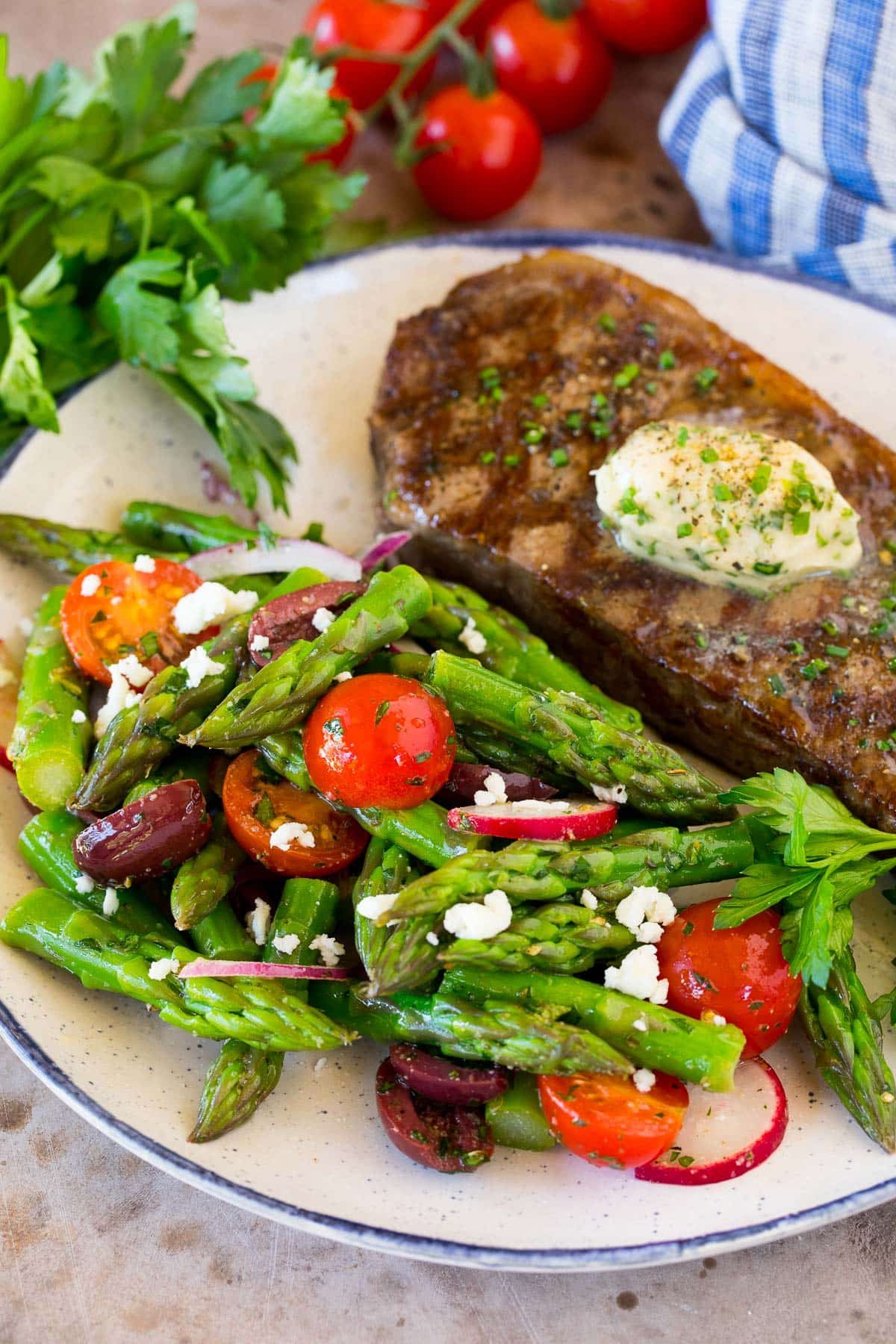 Asparagus salad served with grilled steak.