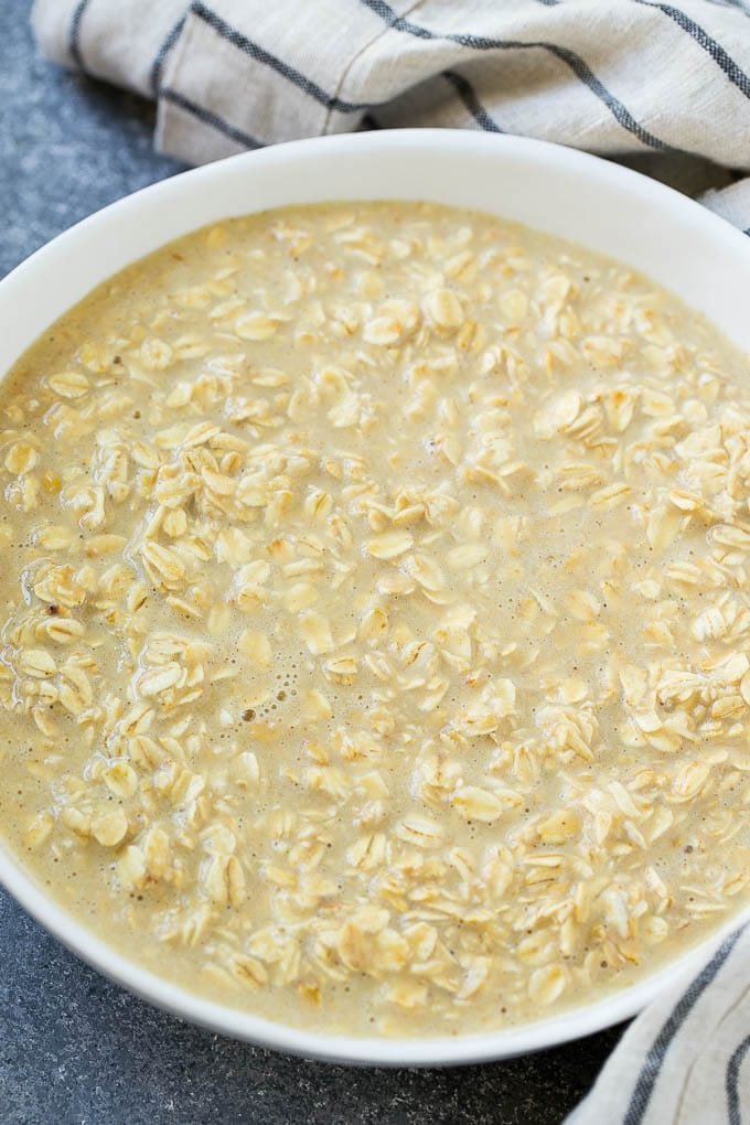 All of the ingredients for baked oatmeal cups mixed up in a bowl.