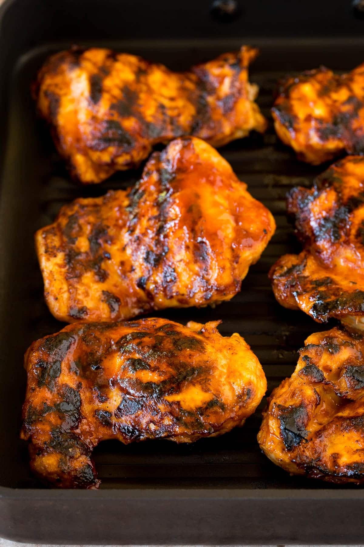 Chicken cooked on a grill pan.