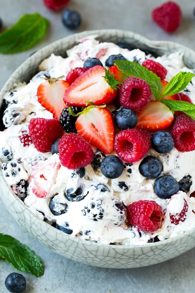 This berry cheesecake salad recipe is a variety of fresh berries tossed in a light and creamy cheesecake mixture. The perfect summer salad!