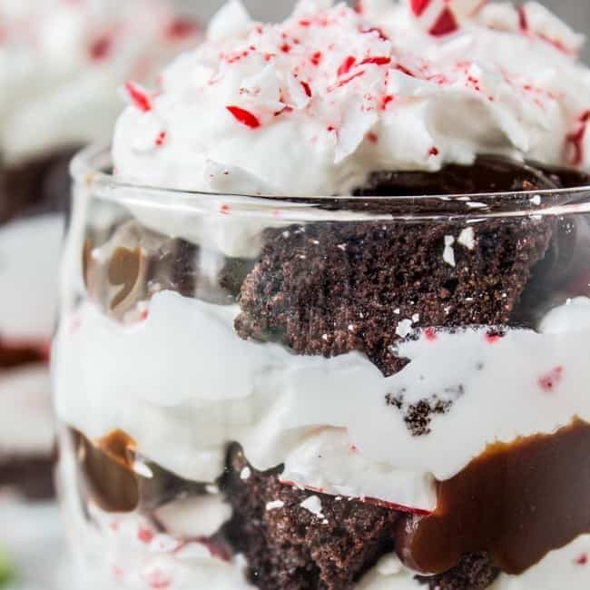 An image of a candy cane brownie trifle in a glass.
