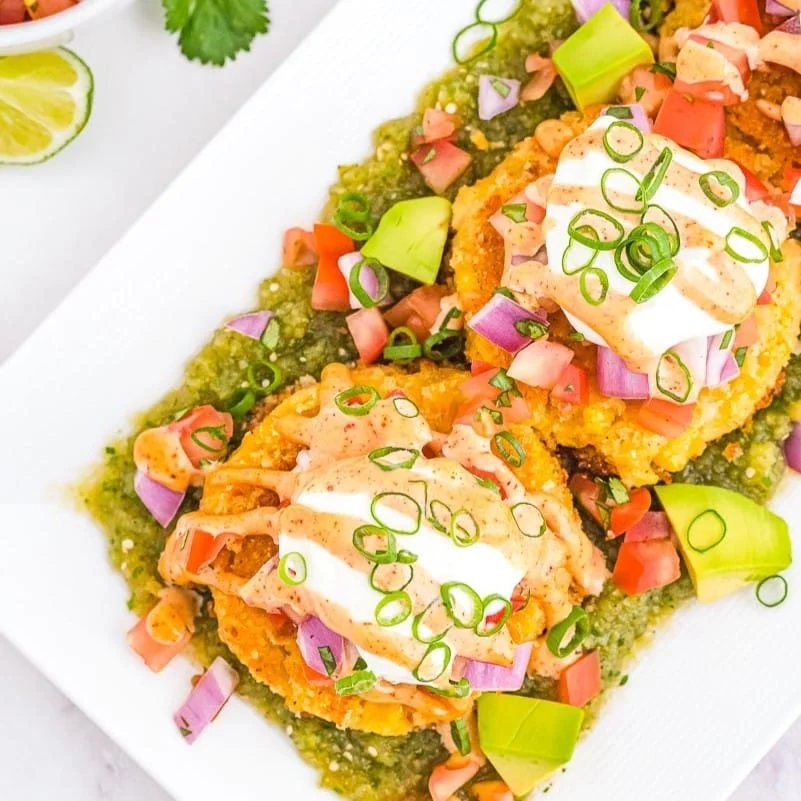 An image of tamale cakes on a long plate.
