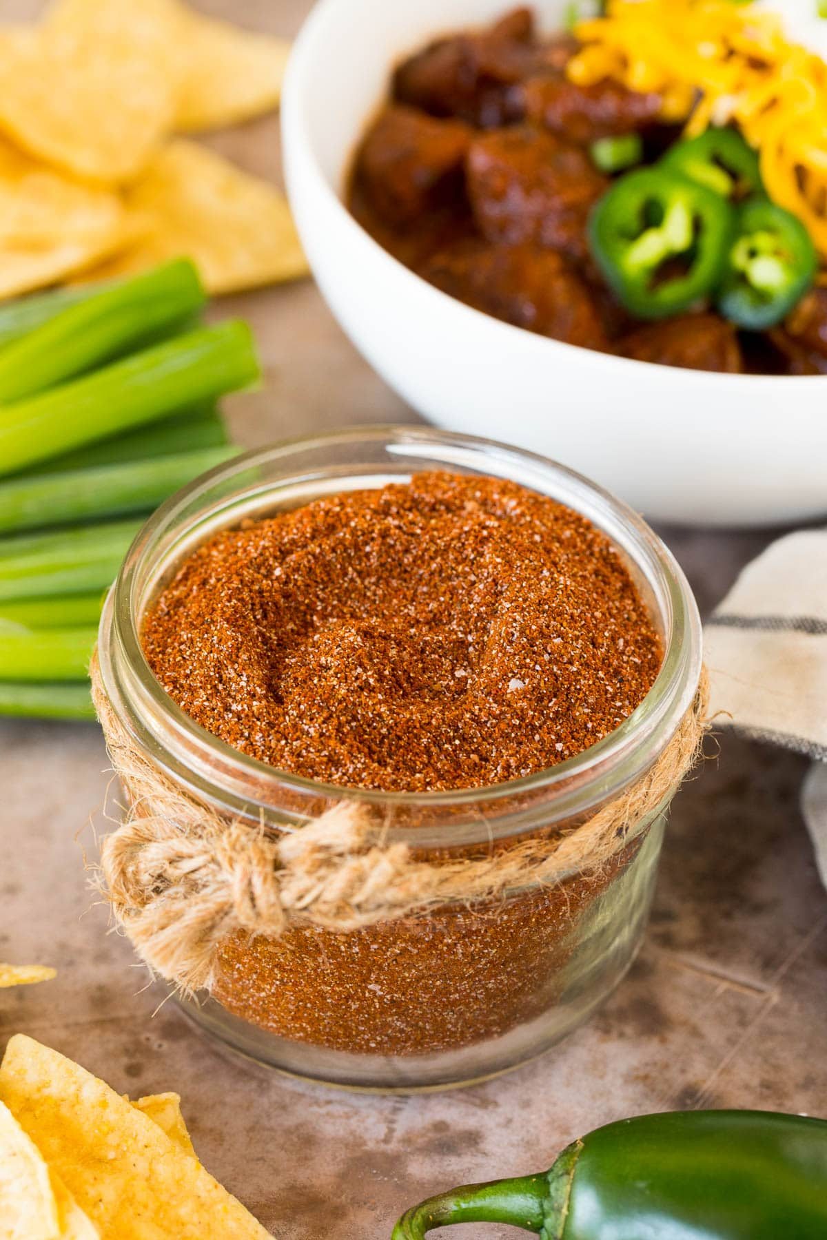 A jar of kitchen-made chili seasoning.