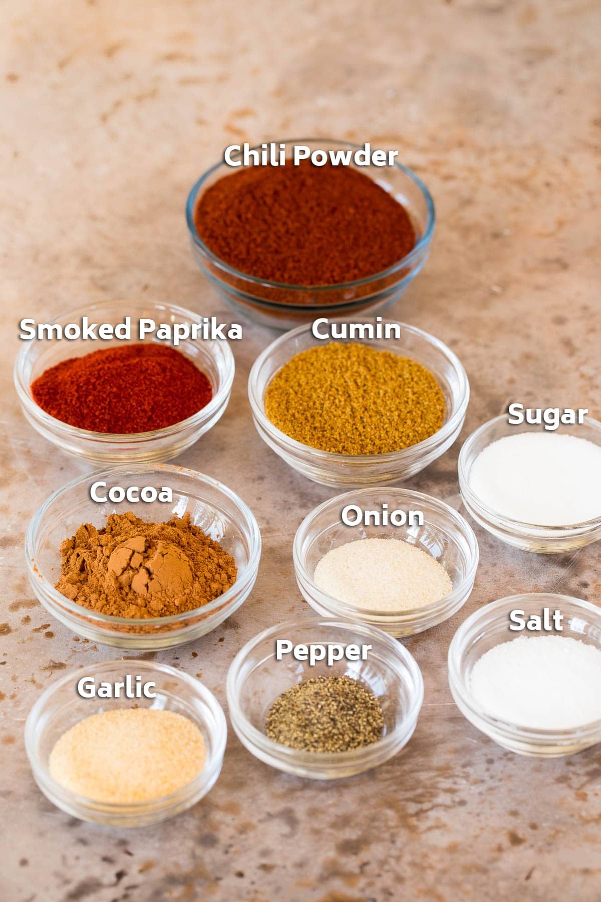 Glass bowls of different types of spices.