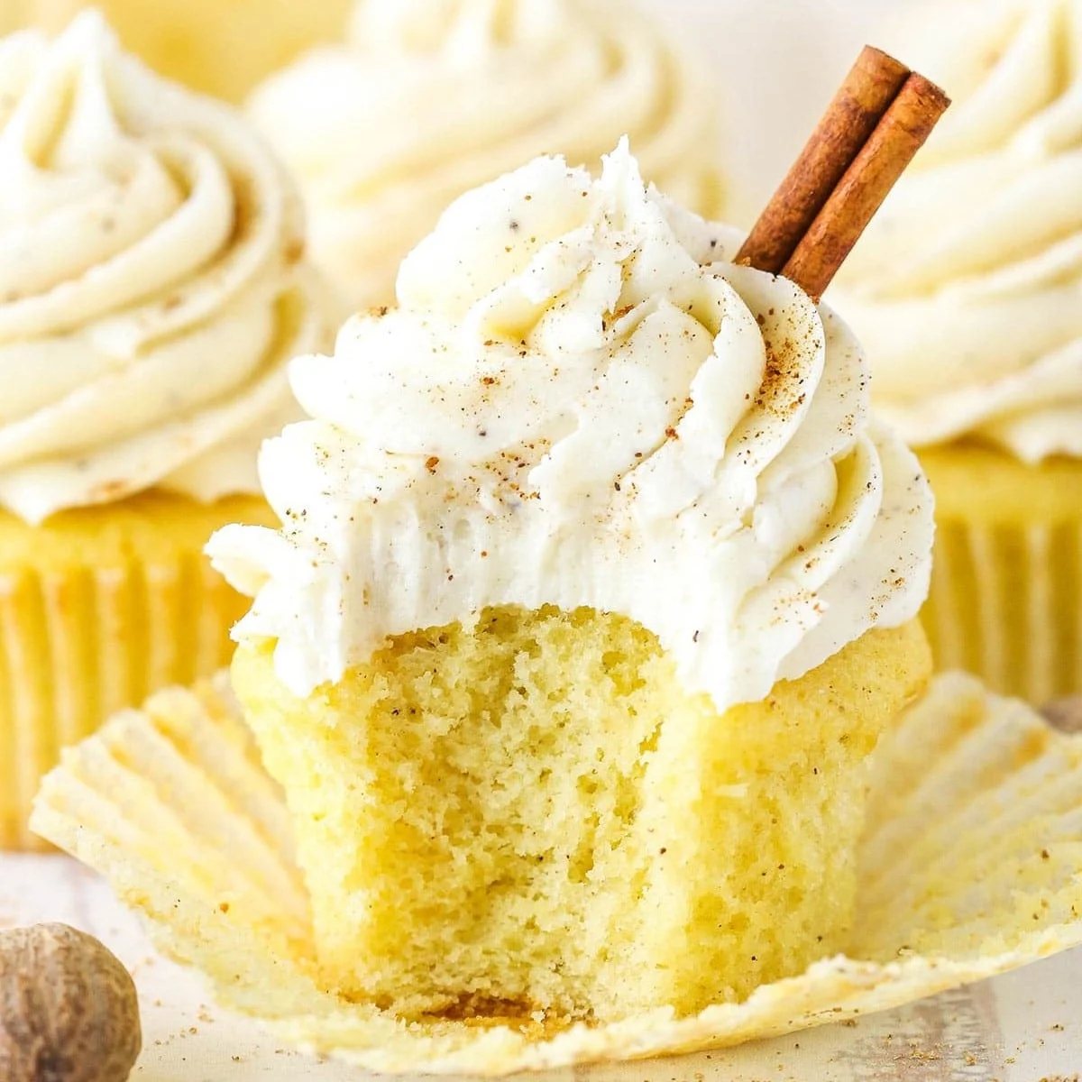 An image of an eggnog cupcake with the wrapper open.