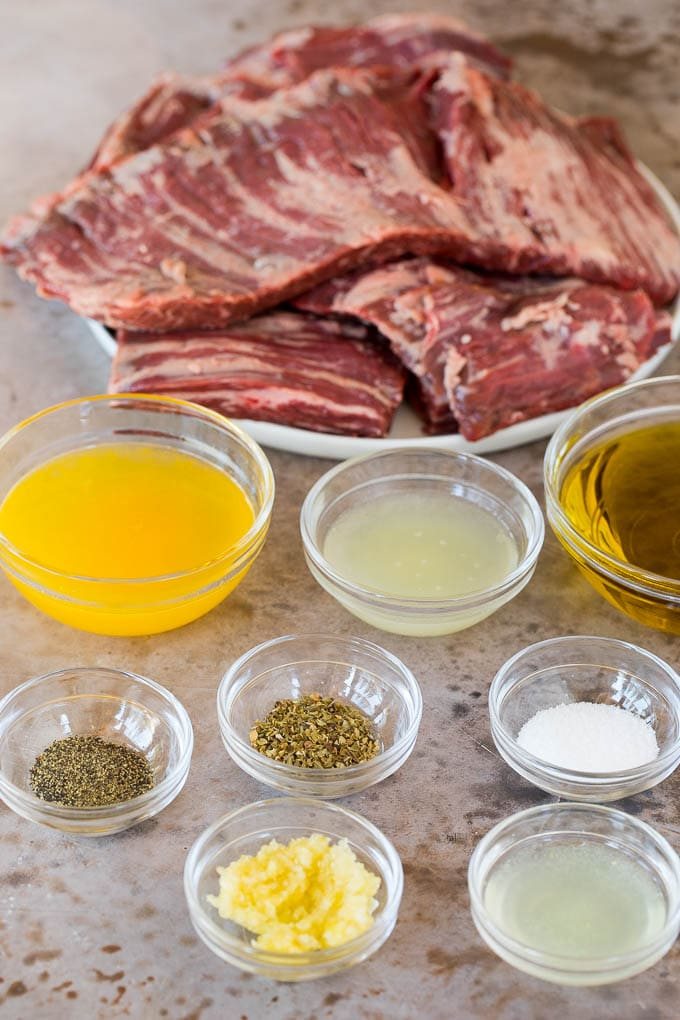 Bowls of ingredients for marinade, and a plate of skirt steak.