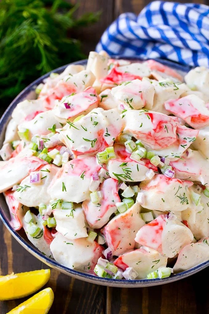 Silky crab salad with fresh vegetables and dill in a mayonnaise dressing.