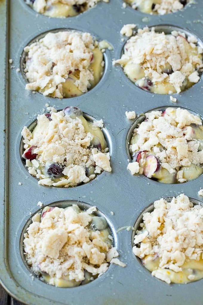 Muffins topped with streusel ready to go into the oven.