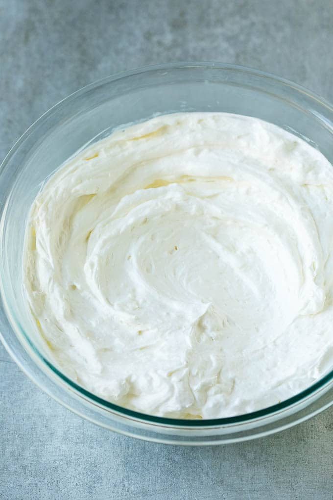 Cream cheese, marshmallow cream and whipped topping in a mixing bowl.