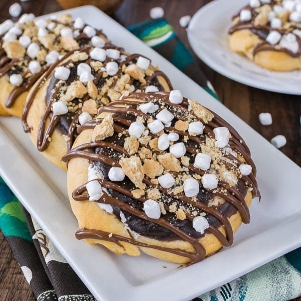 An image of smores cheesecake danishes on a platter.