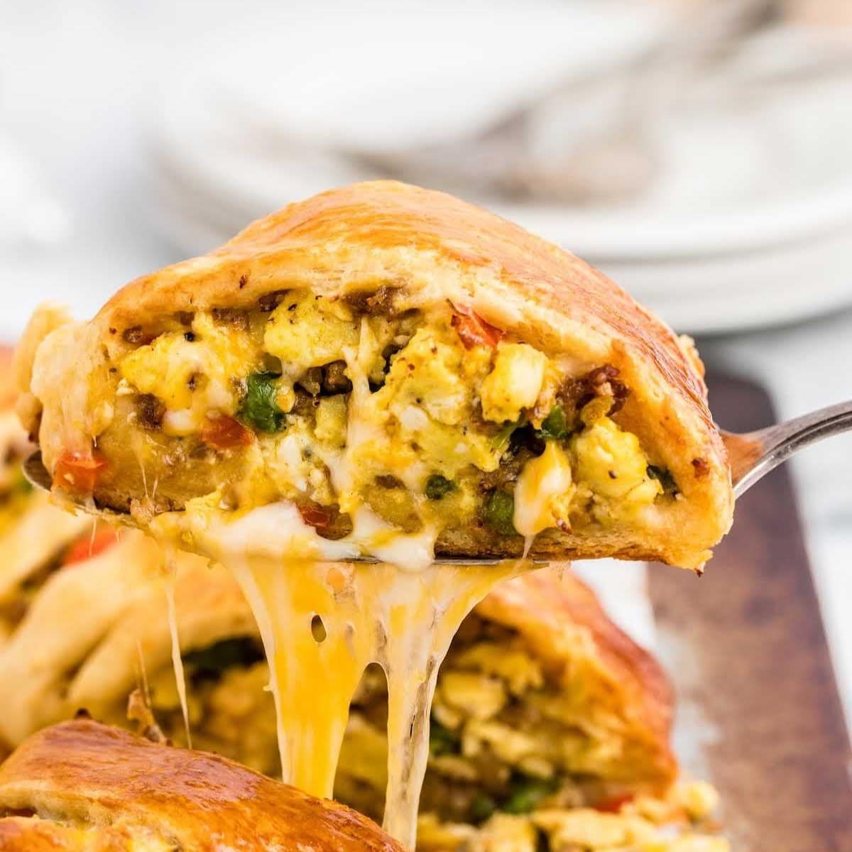 An image of a breakfast crescent ring with eggs and sausage inside.