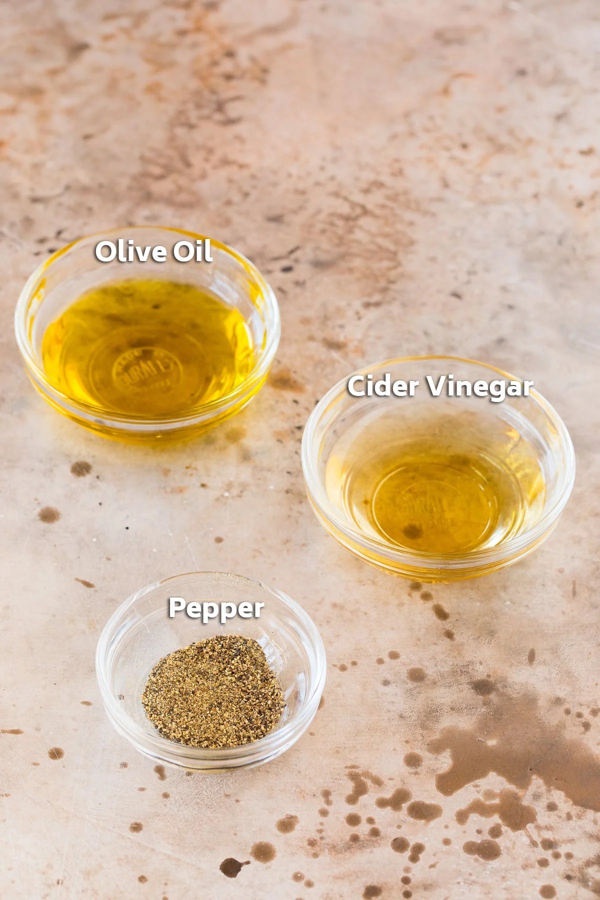 Bowls containing salad dressing ingredients.