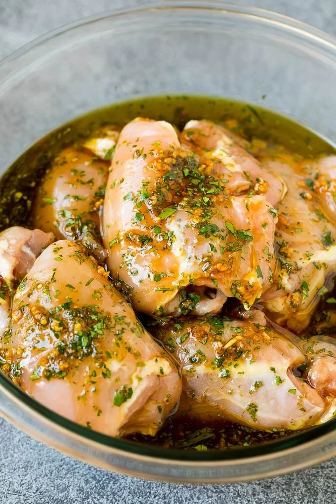 Poultry in a bowl of marinade.
