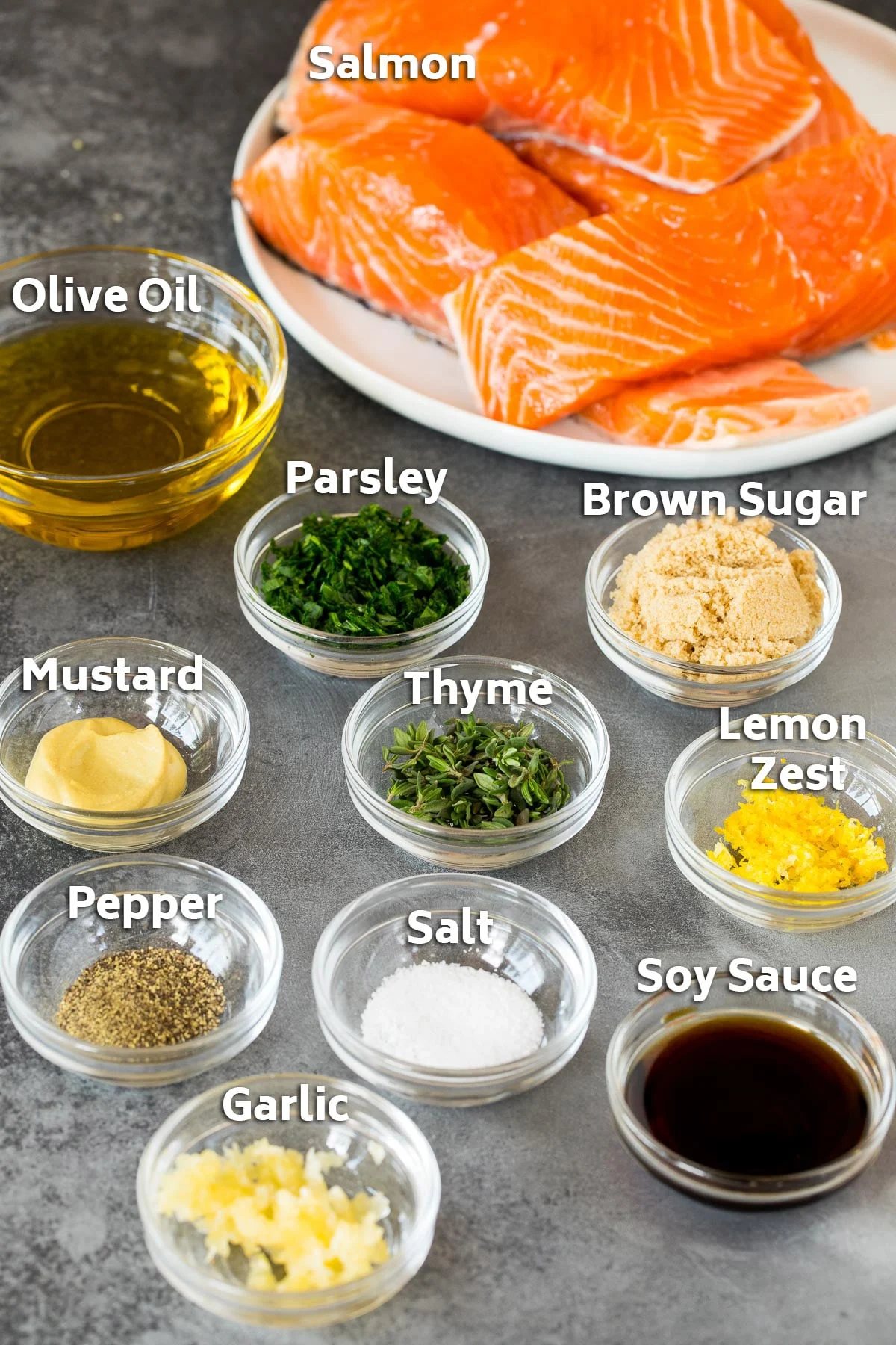 Ingredients including fillets, olive oil, soy sauce, herbs and spices.
