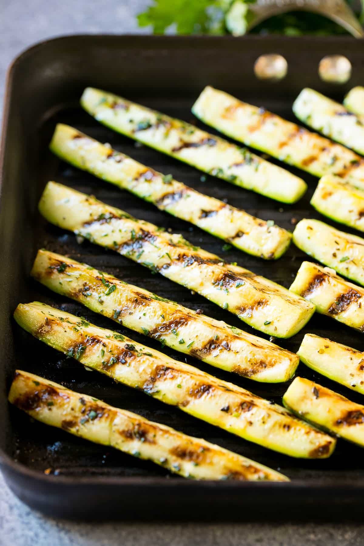Vegetable spears cooked on a grill pan.
