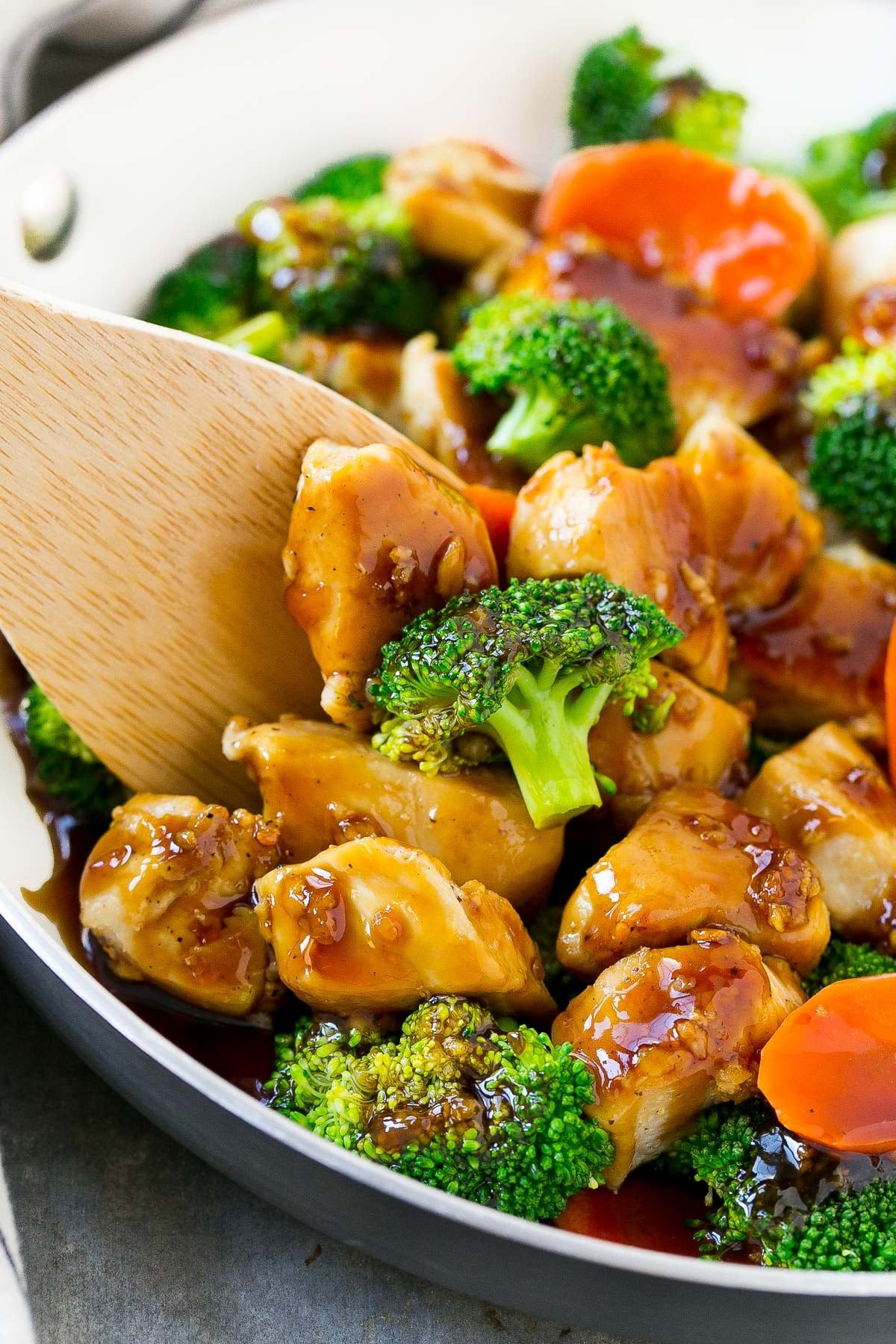 A spatula serving a portion of chicken stir fry.