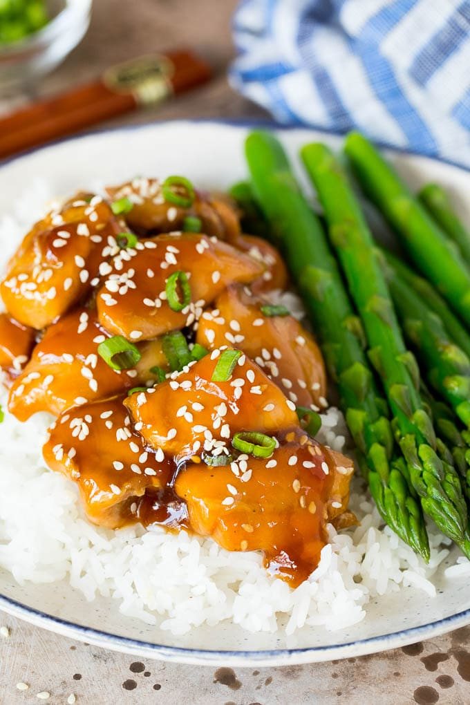 A plate of Instant Pot teriyaki chicken on rice.
