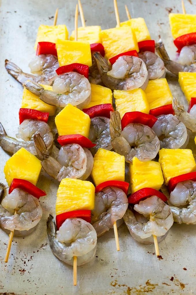 Shrimp, pineapple and peppers on skewers.