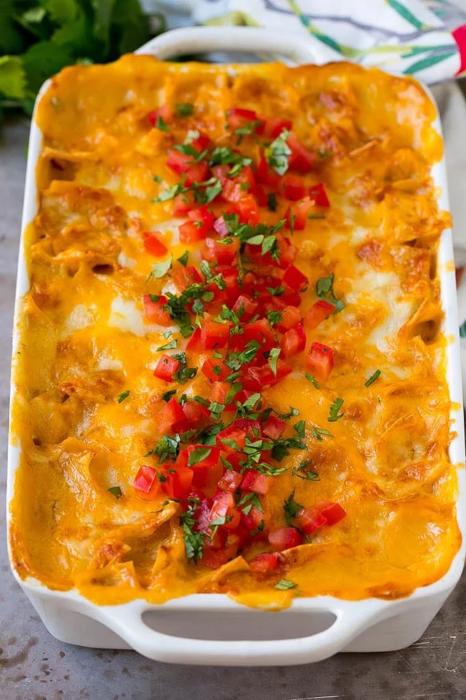 King Ranch chicken with melted cheese, tomatoes and chopped cilantro on top.