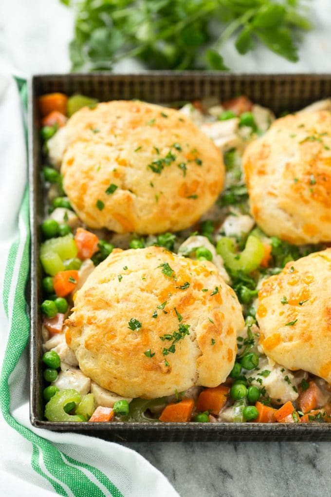 This recipe for biscuit chicken pot pie is a creamy mixture of seasoned chicken, vegetables and herbs that's been topped with flaky cheddar biscuits and baked to perfection.