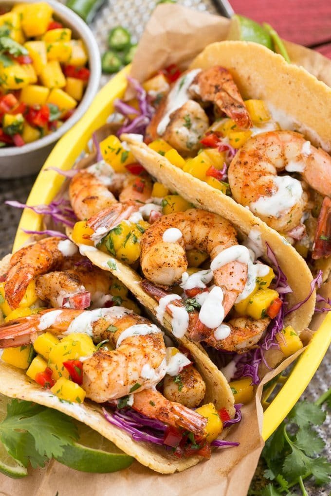 Shrimp tacos with fresh mango salsa and silky sauce.