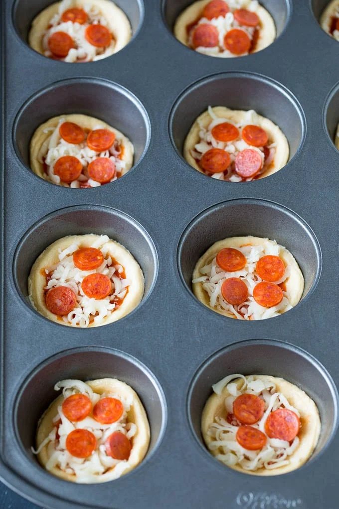Dough topped with sauce, cheese and mini pepperoni.