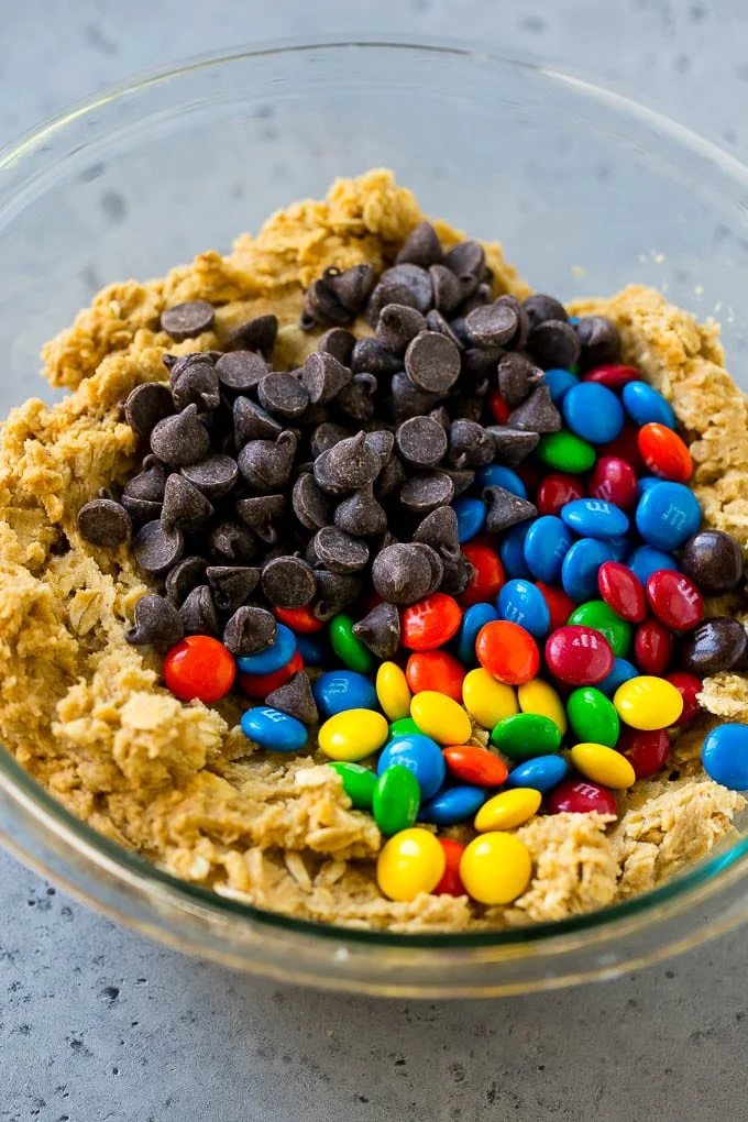 Cookie dough with chocolate chips and M&M's on top.