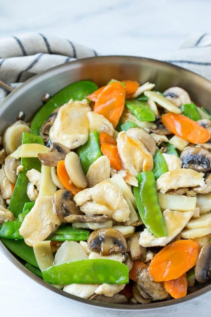 Chicken, vegetable and mushroom stir fry in a pan.