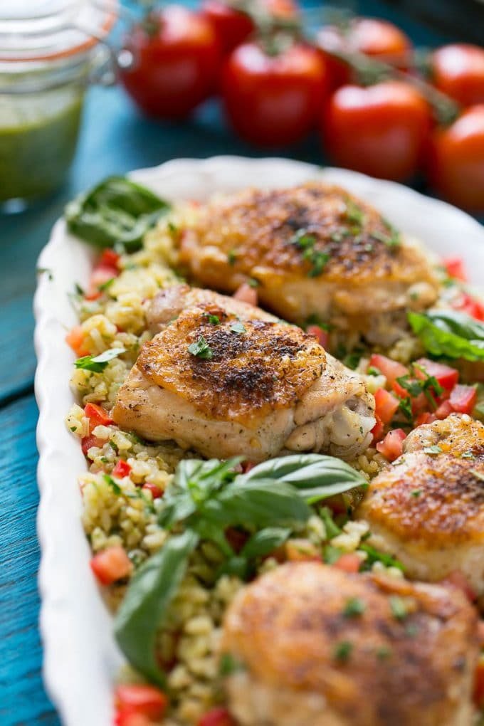 This one pot chicken with tomato basil risotto is the perfect weeknight meal - the whole thing bakes in the oven in a single dish!