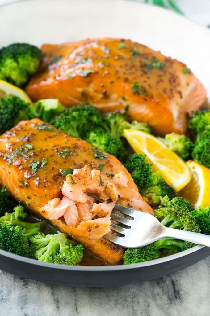 This recipe for honey mustard salmon is seared salmon fillets coated in a sweet and tangy honey mustard sauce. Add broccoli to make a one pot meal!