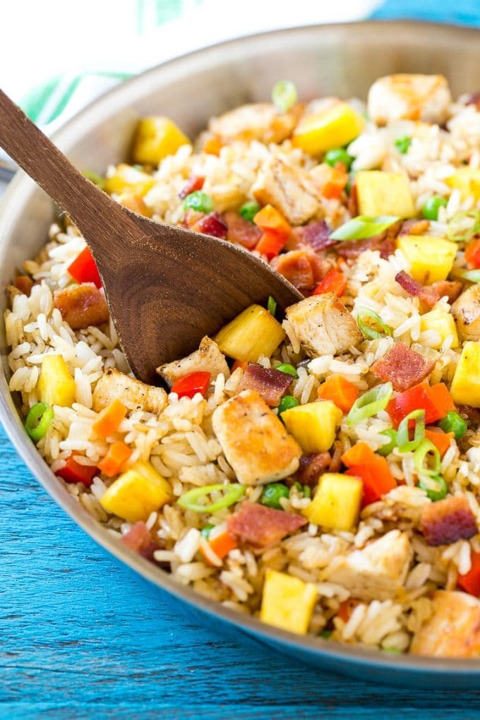 This recipe for pineapple fried rice is loaded with chicken, bacon, crunchy veggies and juicy pineapple. A unfussy and straightforward main course or side dish that's MUCH better than take out!