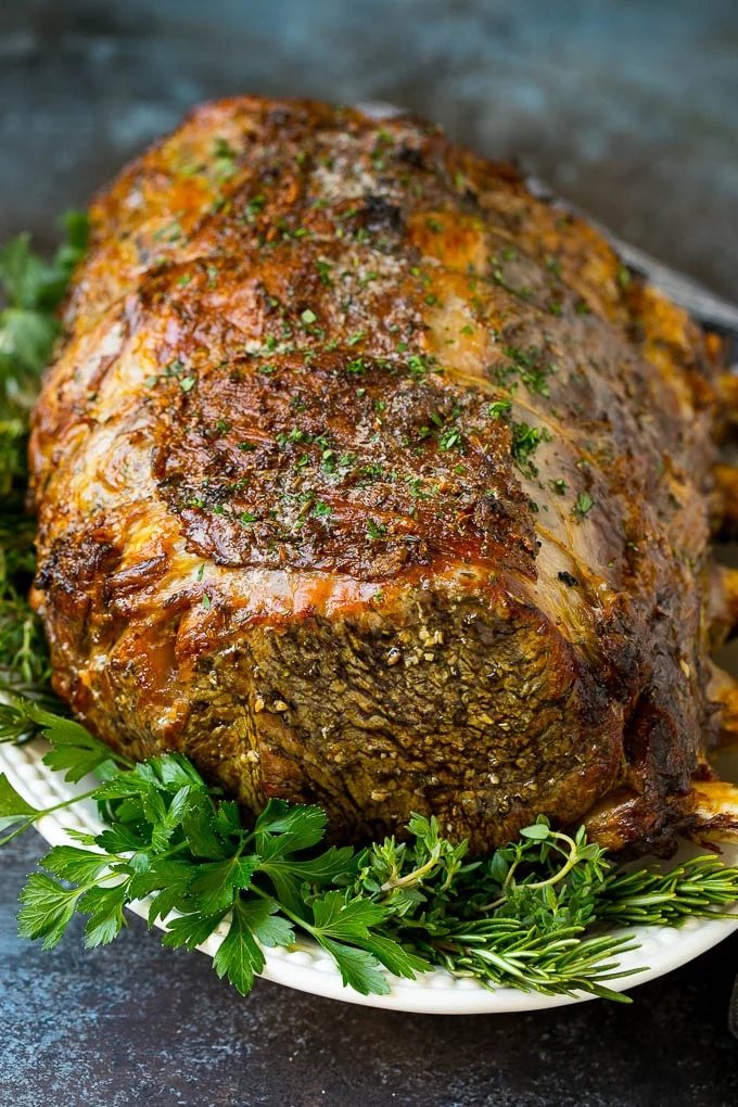 A slow roasted prime rib on a serving platter.