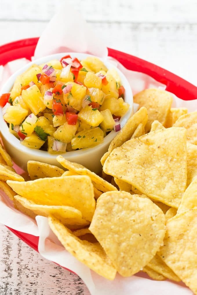 Pineapple salsa served with tortilla chips.