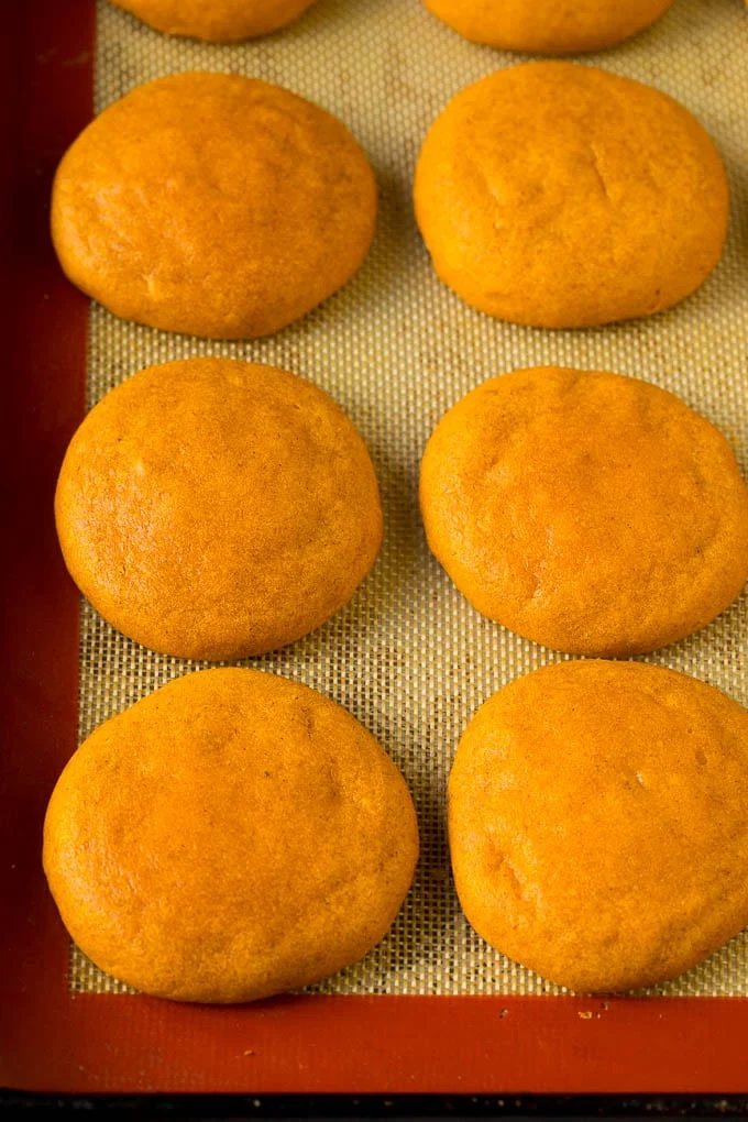 Baked pumpkin cookies on a pan.