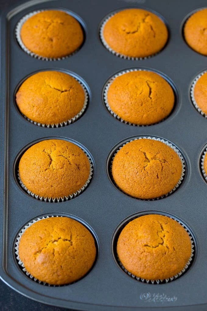 Baked cupcakes in a muffin tin.