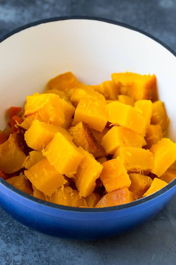 Cubed roasted squash in a large pot.