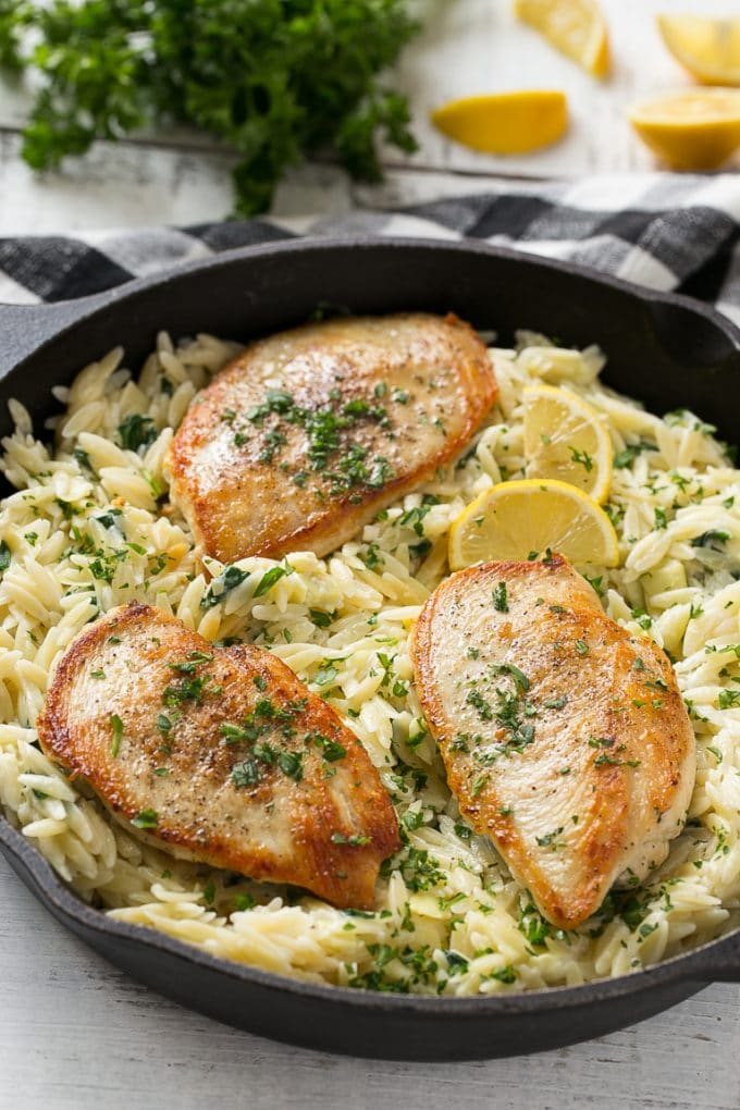 This one pot chicken with silky spinach artichoke pasta is made with seared chicken breasts, orzo pasta, fresh spinach, artichokes and plenty of cheese. It's a quick and straightforward weeknight dinner with less dishes to do at the end!