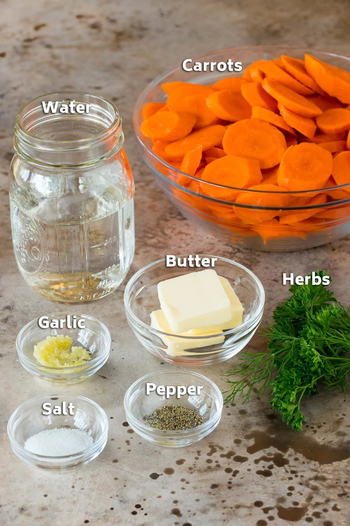 Bowls of ingredients including vegetables, butter and seasonings.