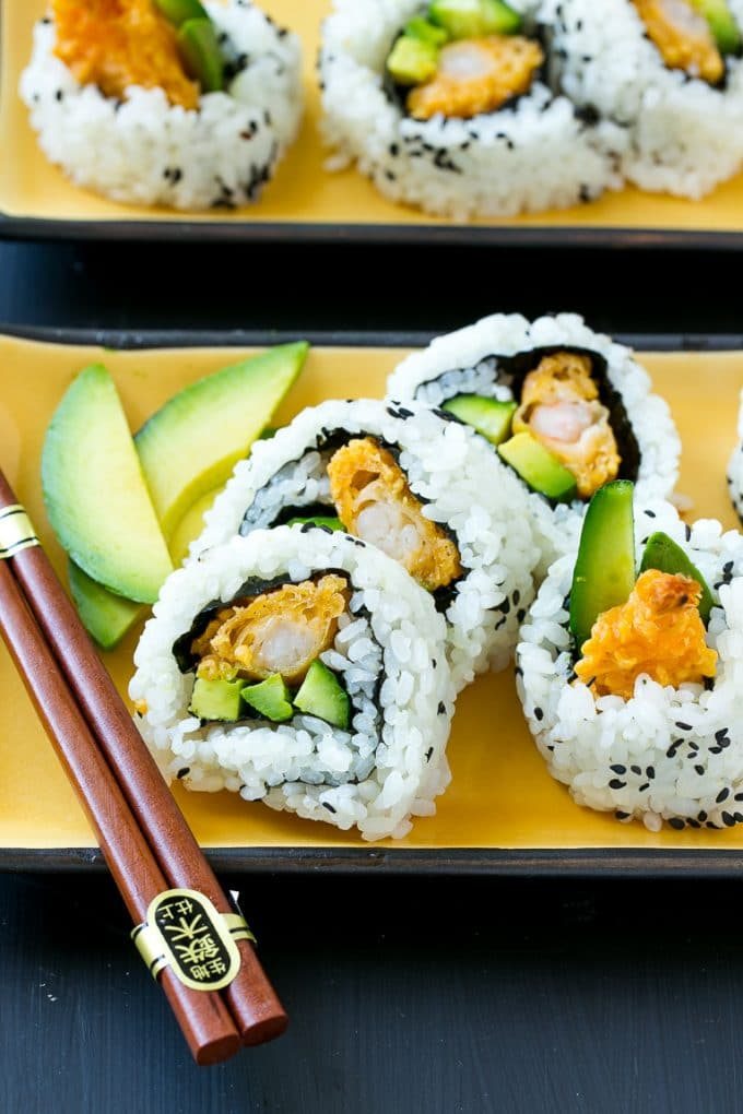 Shrimp tempura sushi roll with cucumber, avocado and crunchy shrimp.