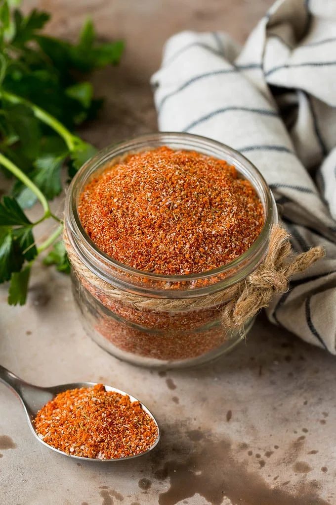 A jar of kitchen-made steak seasoning.