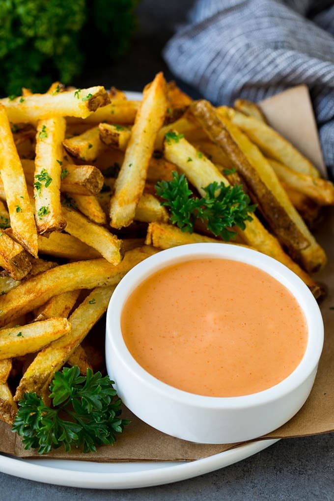 A cup of fry sauce served with kitchen-made french fries.