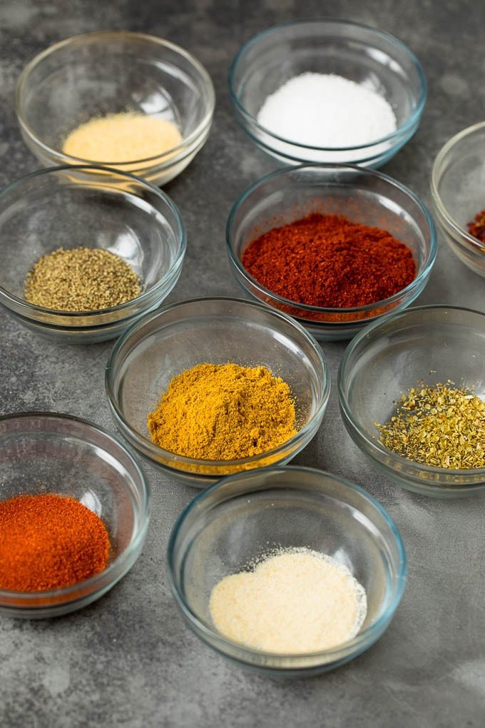Assorted spices in small bowls.
