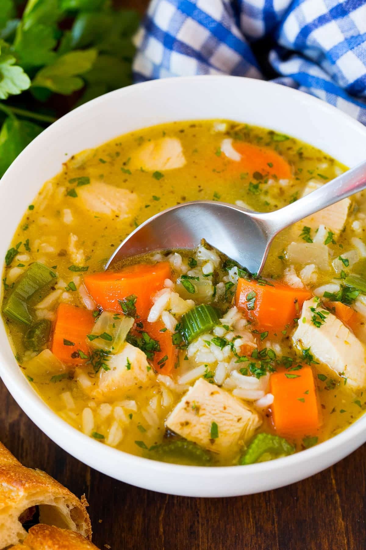 A bowl of soup made with homemade turkey broth, vegetables and rice.