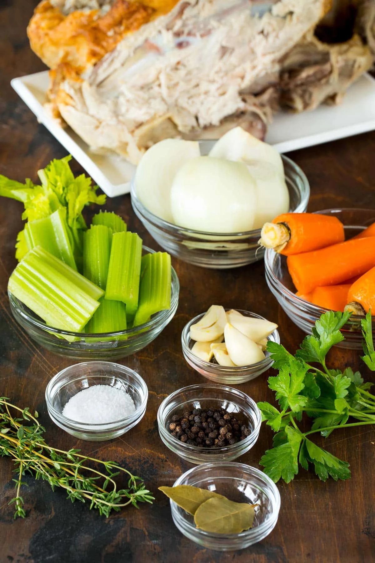 Ingredients including carrots, celery, herbs and spices.