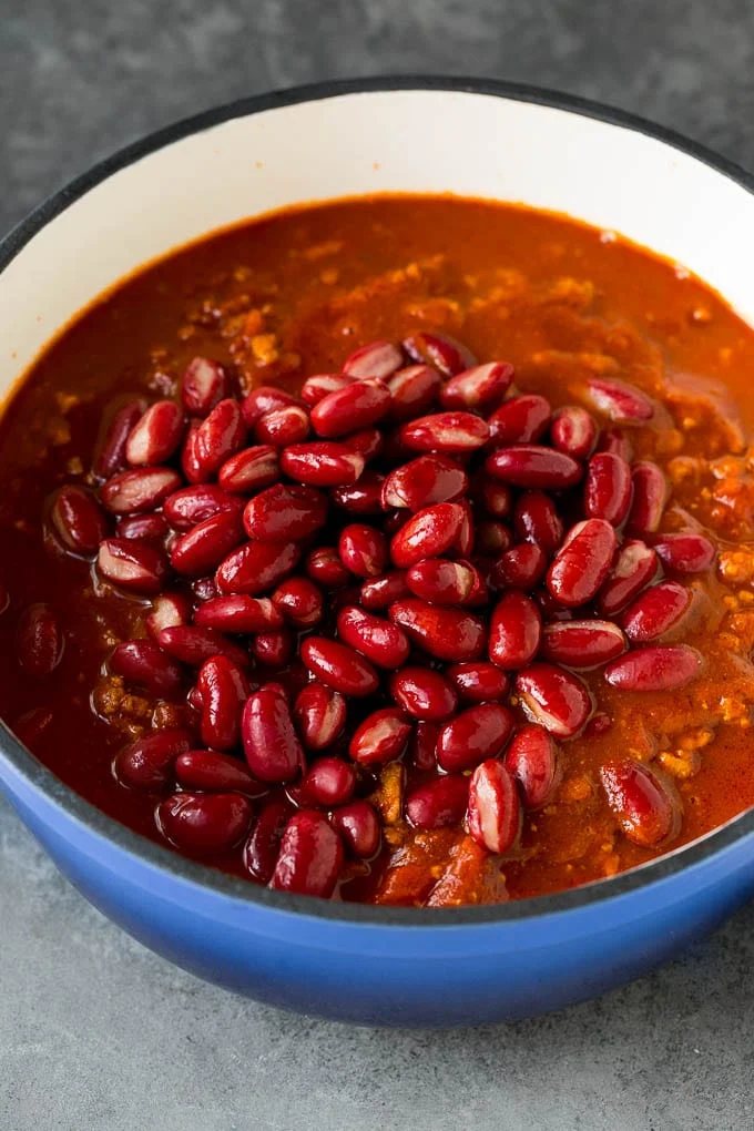 Kidney beans in a pot of turkey with spices and tomato sauce.