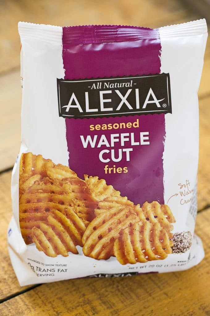 Waffle fries are smothered in nacho toppings for a fun and delicious snack.